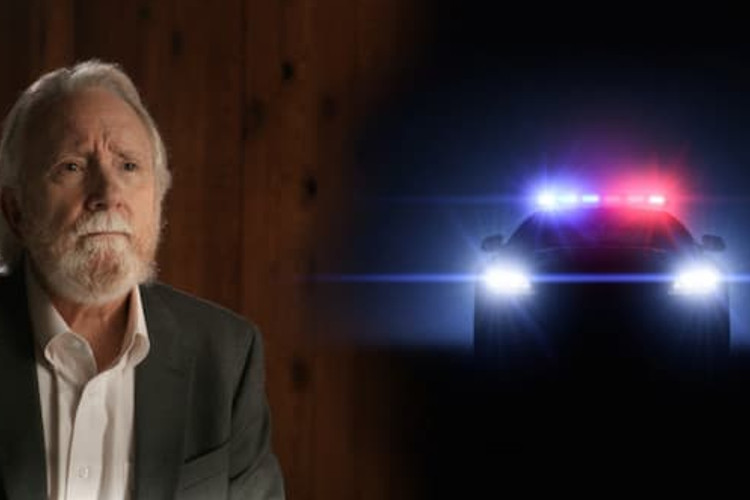 Norm Stamper and police car